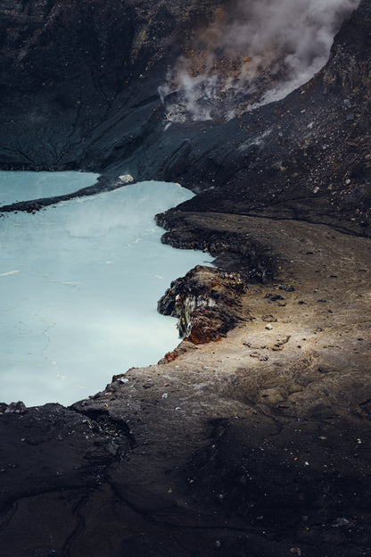 Fine art photograph of steam rising from Poas volcano turquoise crater lake in Costa Rica by Basile Tournier